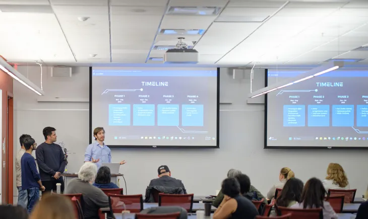 Students pitching to industry panel
